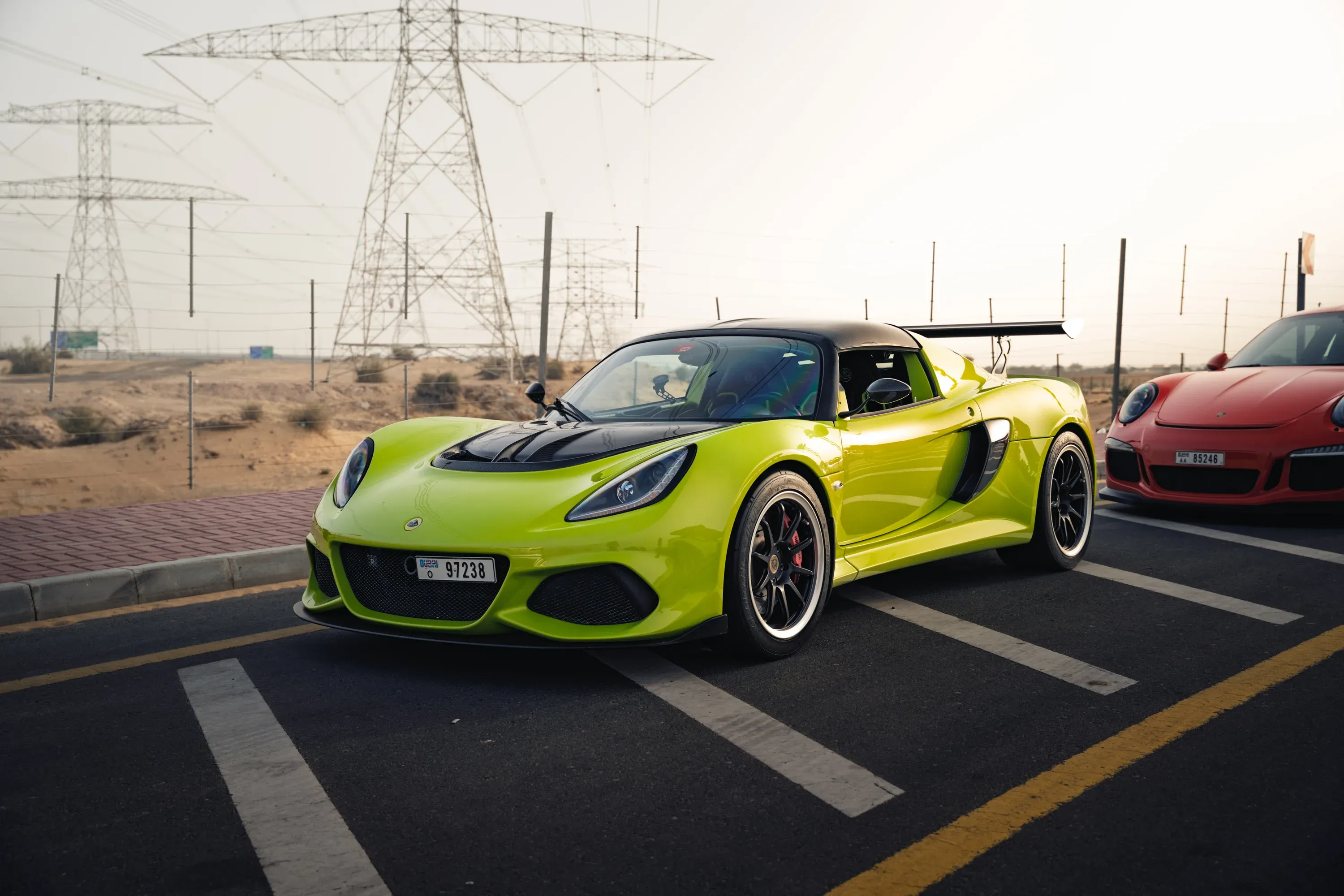 Mercedes-Benz driving through a wooded area, soft light.