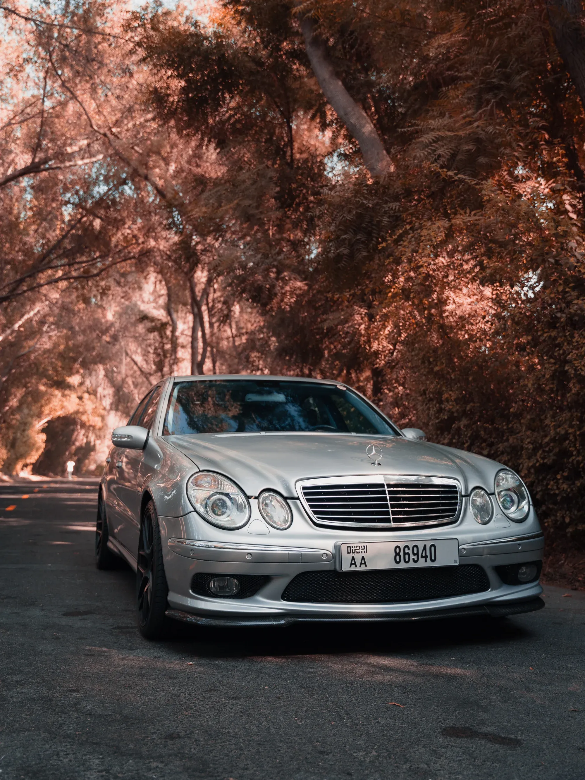 Front view of W211 and W210 Mercedes parked together.
