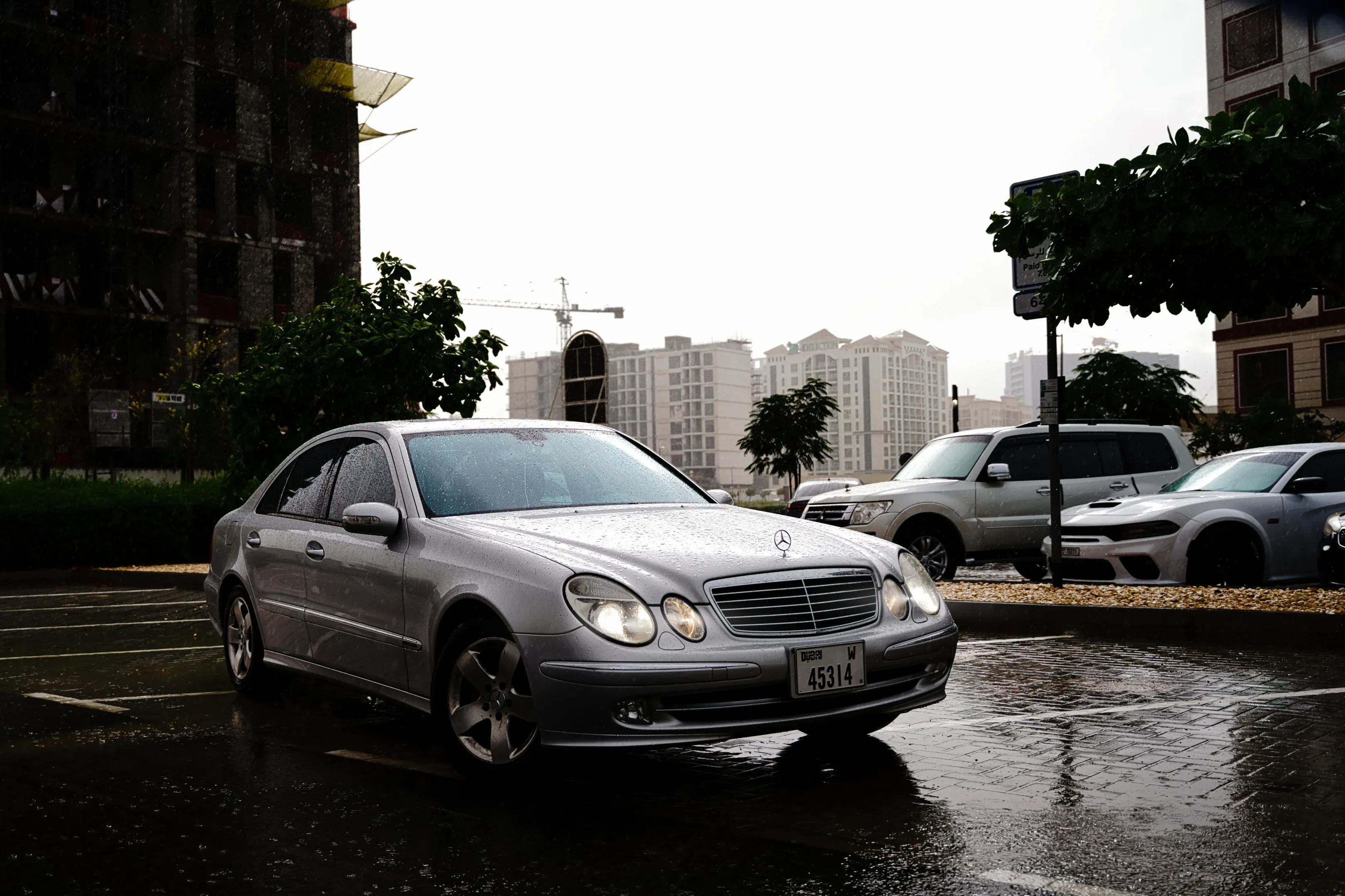 Moody grey: Capturing the timeless form of the E-Class W211 on a rare overcast day in Dubai.