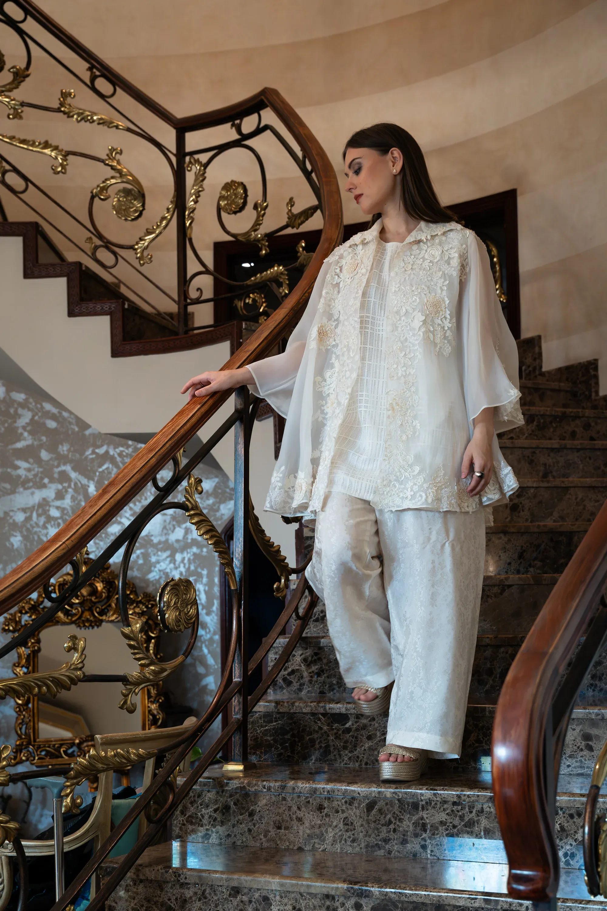 Model walking in a flowy dress, dynamic movement.