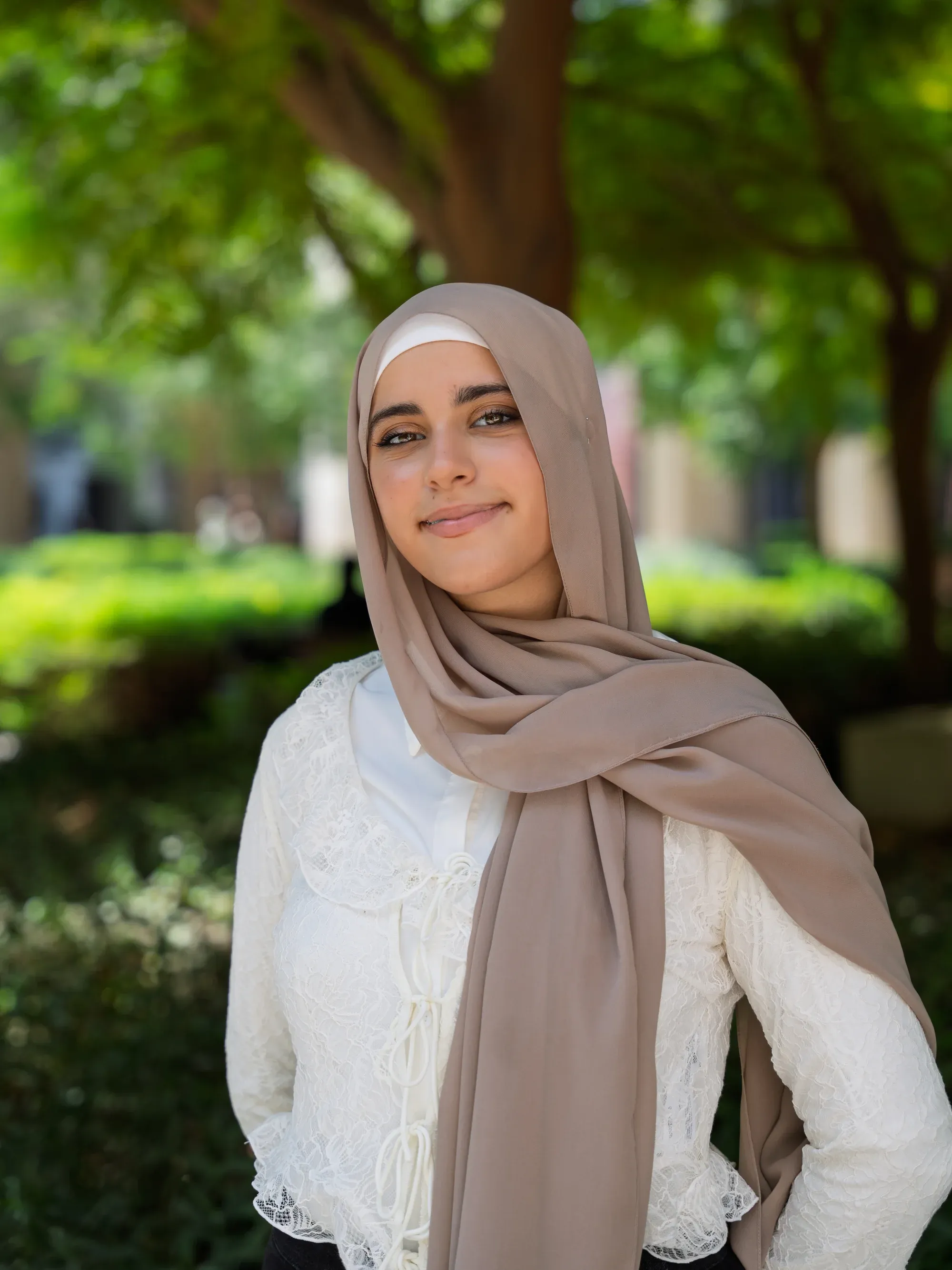 Classic car driving through narrow city streets, vintage feel.