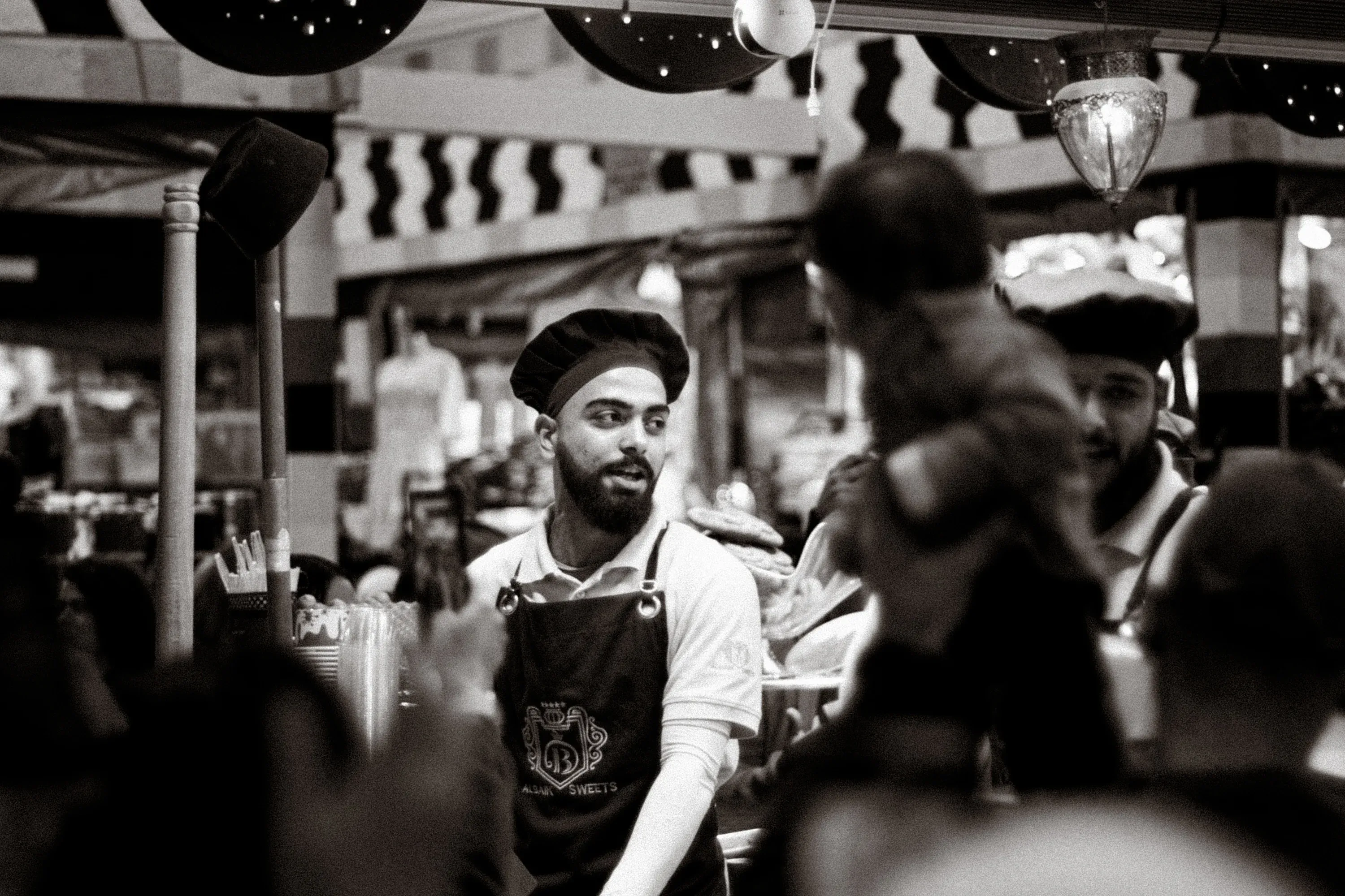 Silhouette of a person walking through a tunnel of light.